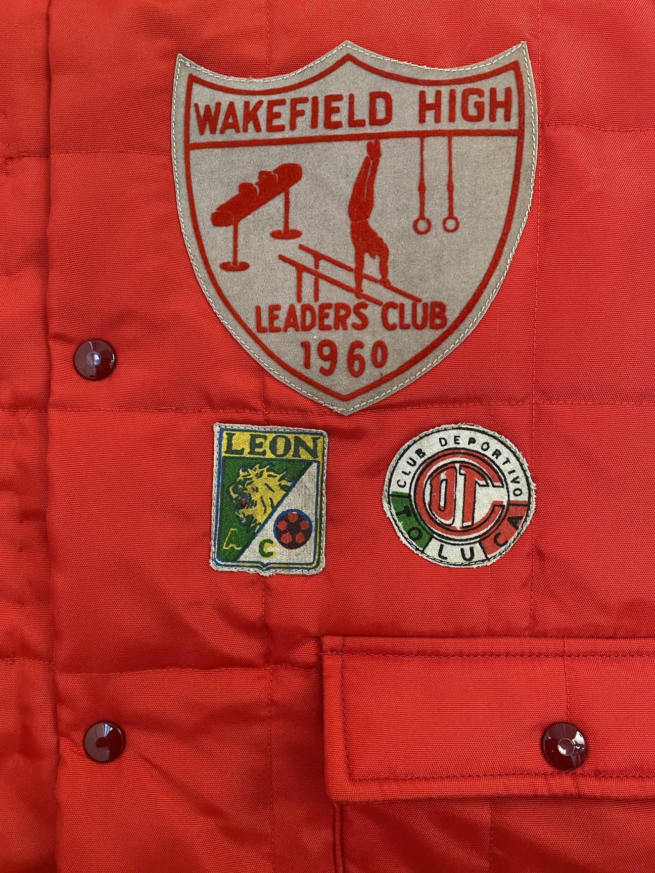 Red Puffy Jackets patches details